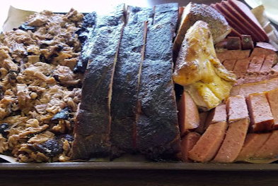 Elmer's BBQ signature dishes Smoked Brisket
Pulled Pork
"The Famous Badwich"